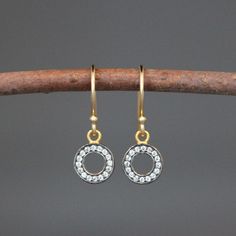 "Sparkling White Topaz stones are pave set in rhodium plated gold vermeil circles. These dangle from gold vermeil balled earwires. The backs of the charms are pierced to allow light to shine through so the stones can shimmer. Save these shimmering earrings for a special occasion (a wedding perhaps?) or wear them everyday to brighten up your work week! White Topaz charms: 9x12mm Total length of earrings: 1\" All gold is 18k gold vermeil. As the owner, maker, designer, and curator of this shop, I Pave Earrings, White Topaz Earrings, Earrings Circle, Special Occasion Jewelry, Topaz Earrings, Earrings White, Topaz Stone, Work Week, Circle Earrings