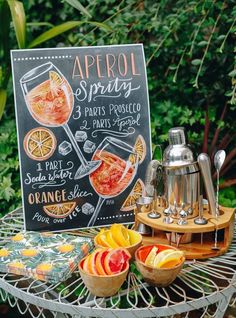 a sign that says apricot sprits on it next to bowls of fruit