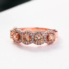 Rose Gold Halo Five Stone Champagne Stone RingEmbedding diamonds by handcraft. Exquisite design made perfect for an engagement ring, wedding ring, promise ring, bridal ring set, anniversary ring, couples ring, and more. Wonderful gifts for birthdays, Mother's Day, Valentine's Day, Thanksgiving, Christmas, and all other occasions.Our mission is to create premium stones that shine like a natural diamond. Gemstone types, shapes, colors, and cuts were carefully designed and handcrafted to perfection Rose Gold Sapphire Ring With Diamond Halo, Rose Gold Sapphire Ring With Halo Design, Rose Gold Sapphire Halo Ring, Rose Gold Sapphire Ring With Halo, Rose Gold Halo Setting Round Wedding Ring, Rose Gold Sapphire Ring With Diamond, Rose Gold Sapphire Ring With Halo Setting, Rose Gold Halo Ring With Prong Setting For Promise, Anniversary Rose Gold Topaz Ring With Prong Setting