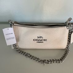 Silver/Chalk. 100% Authentic With Tags Included. Straight From Woodbury Common Premium Outlets. Dm If Any Questions. Coach Charlotte Bag, Classic White Pouch Shoulder Bag, Coach Cream Pouch Shoulder Bag, Chic Cream Coach Shoulder Bag, Chic Cream Coach Bag, Coach Cream Shoulder Bag With Branded Hardware, Cream Bags With Silver-tone Hardware For Daily Use, Cream Shoulder Bag With Silver-tone Hardware For Shopping, Designer Cream Bag With Silver-tone Hardware