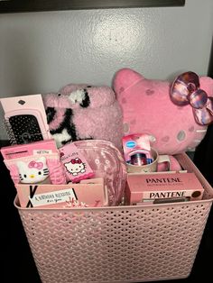 a pink hello kitty hamper filled with personal care items