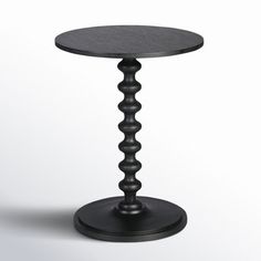 a small black table on a white background