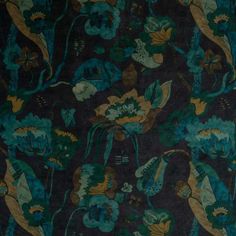 a blue and green floral pattern on black fabric