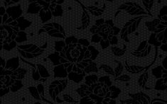 a black and white floral pattern on a dark background with hexagonal grids