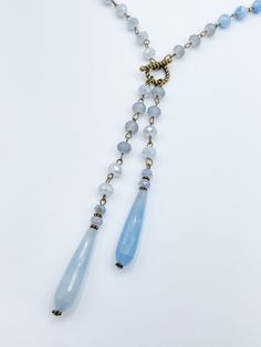 This Sparkly Beaded Long Necklace is perfect for any occasion. Crafted with two shimmering strands featuring a stunning drop feature, you get the elegance of a necklace with the convenience of two pieces in one. Its beautiful sparkles will add a touch of glamour to any look. Details: Long Opera Length Necklace Available in Two Colors, Blue or Purple Drop Feature of Two Beaded Strands and Long Tear Drop Stones Sparkly Faceted Beads Toggle Clasp Closure at Drop Feature Approximate Dimensions: Leng Beaded Toggle Clasp, Length Necklace, Long Beaded Necklace, Crystal Drop, Toggle Clasp, Tear Drop, Faceted Bead, Jewelry Ideas, Long Necklace