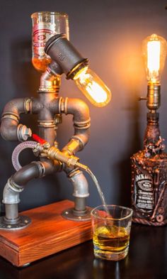 an old fashioned faucet is turned into a lamp with a glass on the side