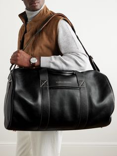 Brunello Cucinelli's duffle bag is a sensible investment for overnight trips and short breaks, both business and pleasure. It's been crafted in Italy from leather and has capacity for up to 52 litres' worth of packing. The contrasting handles give it both structure and an added sense of refinement. Duffle Bag For Men, Leather Garment Bag, Leather Duffle Bag Men, Mens Duffle Bag, Business Bags Men, Leather Wash Bag, Business And Pleasure, Pocket Books, Leather Duffle Bag