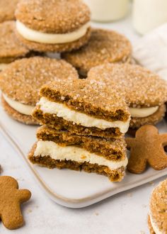 some cookies are stacked on top of each other with white frosting and graham crackers