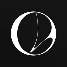 a black and white photo with the letter o in it's center, on a dark background