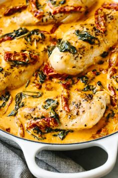 chicken with spinach and cheese in a skillet