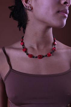 This handmade Necklace is strung on silk which gives it both strength and flexibility. The red beads are hand-carved coral. Handmade Coral Beads, Elegant Adjustable Red Coral Necklace, Artisan Red Coral Beaded Necklaces, Adjustable Red Coral Necklaces, Unique Red Coral Beaded Necklaces With Large Beads, Adjustable Single Strand Beads, Artisan Red Coral Necklace With Large Beads, Spiritual Wooden Beads, Coral Beaded Necklaces With Large Beads