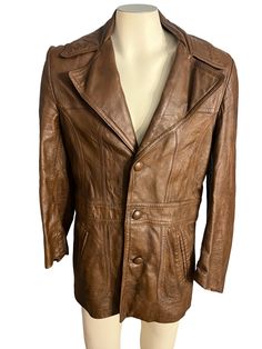 "Vintage brown leather coat,. no maker, sz 40, fully lined, buttons up the front with 3 buttons. Jacket has a spot on the back- in good vintage condition, measurements are shoulder to shoulder 19\" under arms 20\" across waist 18\" across length 30\" sleeve length 25\"" Brown Leather Button-up Blazer, Fitted Brown Leather Button-up Jacket, Fitted Brown Leather Jacket With Double Button Closure, Fitted Brown Leather Jacket With Buttons, Brown Business Blazer With Snap Buttons, Brown Leather Business Jacket With Button Closure, Brown Leather Jacket With Button Closure For Business, Business Brown Leather Jacket With Button Closure, Brown Long Coat Blazer With Buttons