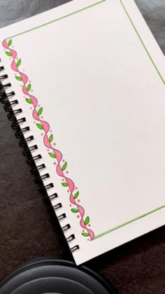 a spiral notebook sitting on top of a table