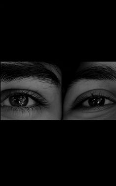 two people's eyes are shown in black and white