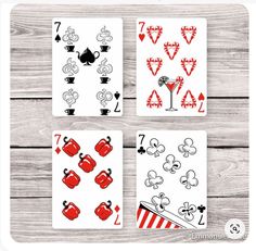 four cards with different designs on them, one in red and the other in black