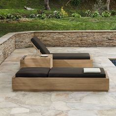 a couch sitting on top of a stone patio