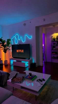 a living room filled with furniture and neon lights