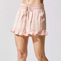 Cut From A Lustrous Fabric In A Ballet Pink Hue, The Satin Ruffle Short From Carbon38 Features A Comfortable Elasticated Waistband And A Fluid, Airy Feel. Balance The Sweet And Feminine Pair With A Fitted Tee, A Denim Jacket, And Simple White Sneakers. 100% Polyester. New With Tags. Feminine Bottoms With Ruffle Hem For Brunch, Feminine Bottoms With Ruffle Hem In Short Length, Feminine Shorts For Daywear, Feminine Bottoms For Daywear, Feminine Bottoms With Elastic Waistband For Brunch, Feminine Ruffle Hem Bottoms For Day Out, Feminine Ruffled Bottoms For Summer, Feminine Summer Bottoms With Ruffles, Feminine Ruffled Bottoms For Day Out