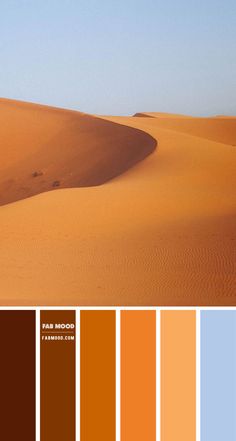 the color palette is brown, blue, and orange in this desert scene with sand dunes