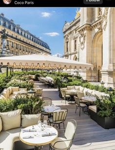 an outdoor seating area with tables and chairs