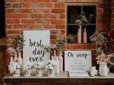 a table with flowers and signs on it