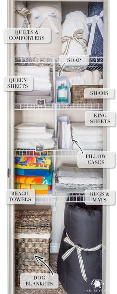 an organized closet with baskets, towels and other items labeled in white letters on it