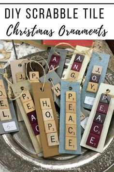 diy scrabble tile christmas ornaments on a silver platter with text overlay that says diy scrabble tile christmas ornaments