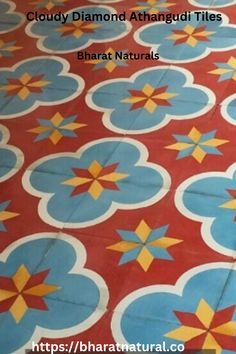 a red and blue tile floor with yellow stars on the bottom, and white dots in the middle