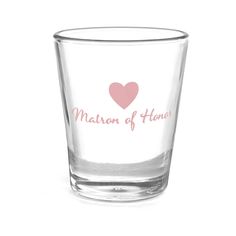 a shot glass with the words maid of home written on it and a pink heart