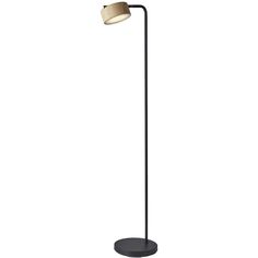 a black floor lamp with a white shade on the base and a beige light bulb