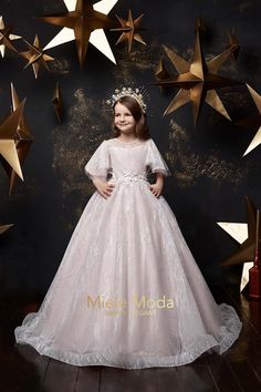 The Alina dress is perfect for your little girls formal event, birthday party, Red Carpet or pageant event. Floor length rich skirt, delicate ruffled sleeves and beautiful back details. Glistering wave pattern throughout the fabric design will make any little girl's heart flutter when she sees her new dress. The bodice is soft satin fabric covered with a layer of tulle. Matching headpiece is not included and optional. FEATURES: Fitted bodice with gorgeous oversized flutter sleeves An elegant ful Star Dresses, First Communion Dress, Dress Birthday, Pink Dresses, Birthday Party Dress, Capped Sleeves, Dress Satin, Super Star, Dress Measurements