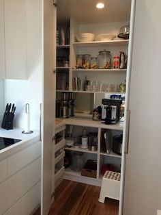 an open pantry with many items in it