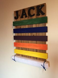 a wooden sign that says jack hanging on the wall