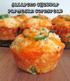 several small muffins with green peppers and cheese in them on a cooling rack