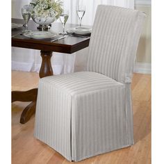 a dining room chair with a striped cover on it