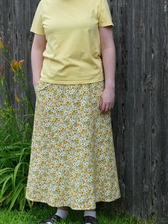 Here is a pretty yellow floral a-line skirt for women. This long skirt is made with a 100% cotton fabric. The fabric has a yellow background with gold and yellow flowers and green leaves all over it. This a-line skirt has a very pretty spiral design giving a snugger fit at the waist and hips, but with plenty of room at the hem. It also has a good sized pocket! This skirt is perfect for church, special occasions, or even just as an everyday skirt. This skirt has a 27" elastic waist that stretches to about 39" and has a length of 34" from the waist to the hem. Thank you for visiting Joyfully Sewn Designs! If you need a bigger or smaller size, please contact me, and I'd be happy to create a custom order just for you! This skirt was made using the delightful "Spiral Boho" skirt pattern by "Sew Boho Skirt Pattern, Everyday Skirt, Maxi Rock, Everyday Skirts, Rock Hat, Modest Apparel, Pretty Yellow, Outfits Modest, Boho Skirt