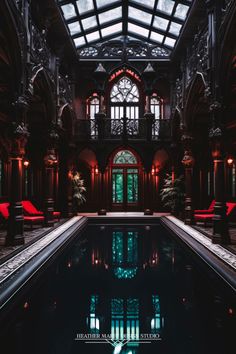 an indoor swimming pool in the middle of a building