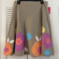 This Beautiful Sunny Leigh Floral Skirt Has Gorgeous Embroidery. Waist 16” Length 24” Side Zipper. 100% Cotton. Perfect For Year Round Wear. Spring Patchwork Knee-length Skirt, Spring Fitted Skirt With Patchwork, Spring Embroidered Beige Skirt, Spring Patchwork Flared Skirt, Spring Fitted Patchwork Skirt, Brown Cotton Knee-length Skirt, Casual Brown Patchwork Skirt, Spring Brown Patchwork Skirt, Spring Mini Skirt In Brown