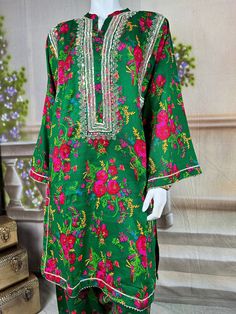 Embrace the vibrant cultural heritage of Sindh with this exquisite kurta salwar set. This kurta and salwar is adorned with intricate tilla embroidery, showcasing delicate gold threads that form traditional motifs. Complementing the tilla work are sparkling mirror embellishments, adding a touch of glamour and shimmer to the ensemble. The dress, crafted from soft, comfortable cotton fabric, provides a perfect balance of tradition and modern elegance. Ideal for festive occasions and cultural celebr Tilla Embroidery, Pakistani Kurta, Eid Dress, Eid Dresses, Cultural Celebration, Mirror Work, Gold Threads, Salwar Kameez, Printed Cotton