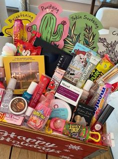 a wooden box filled with lots of different types of cosmetics and beauty products on top of a table