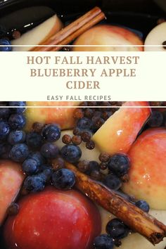 apples, blueberries and cinnamon sticks with text overlay reading hot fall harvest blueberry apple cider