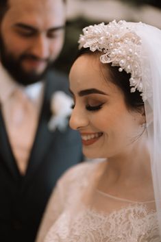 a bride and groom standing next to each other