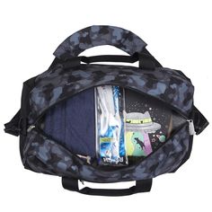 an open duffel bag with various items in the back and side pockets, on a white background