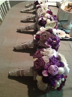 wedding bouquets are lined up on the table