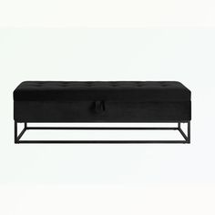 a black bench sitting on top of a white floor