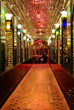 a long hallway with many lights on the ceiling