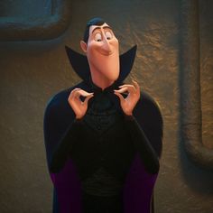 the villain from disney's animated movie maleficent is holding his hands up to his chest