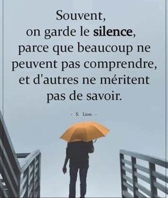 a person holding an orange umbrella standing on a bridge with the quote souvennt, on garde le science, par que beaucoup ne peuvret pas comprend de l'entre d'utes