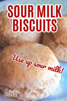 three biscuits on a plate with the words sour milk biscuits