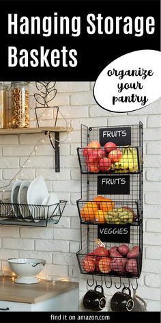 hanging storage baskets for fruits and veggies on a kitchen wall with text overlay that reads, hanging storage baskets organize your pantry